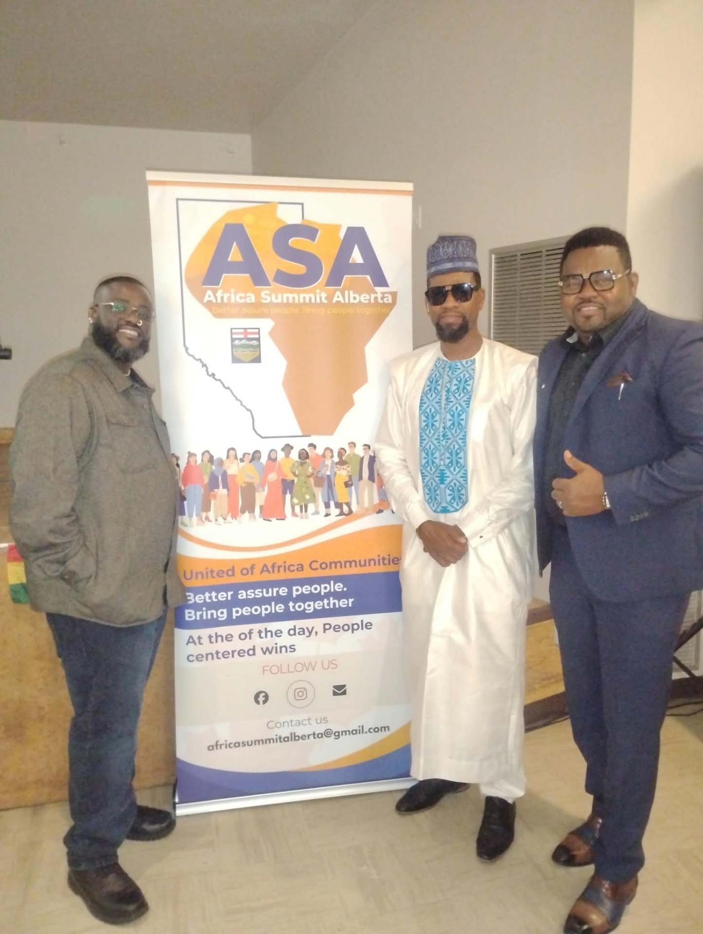 Community members with the Africa Summit Alberta banner