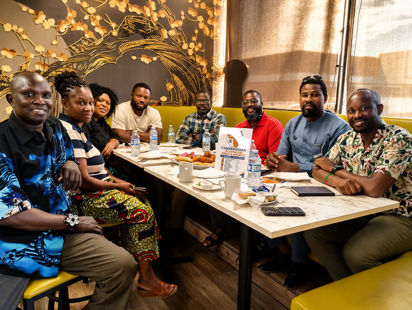 Members gathered around a shared community meal